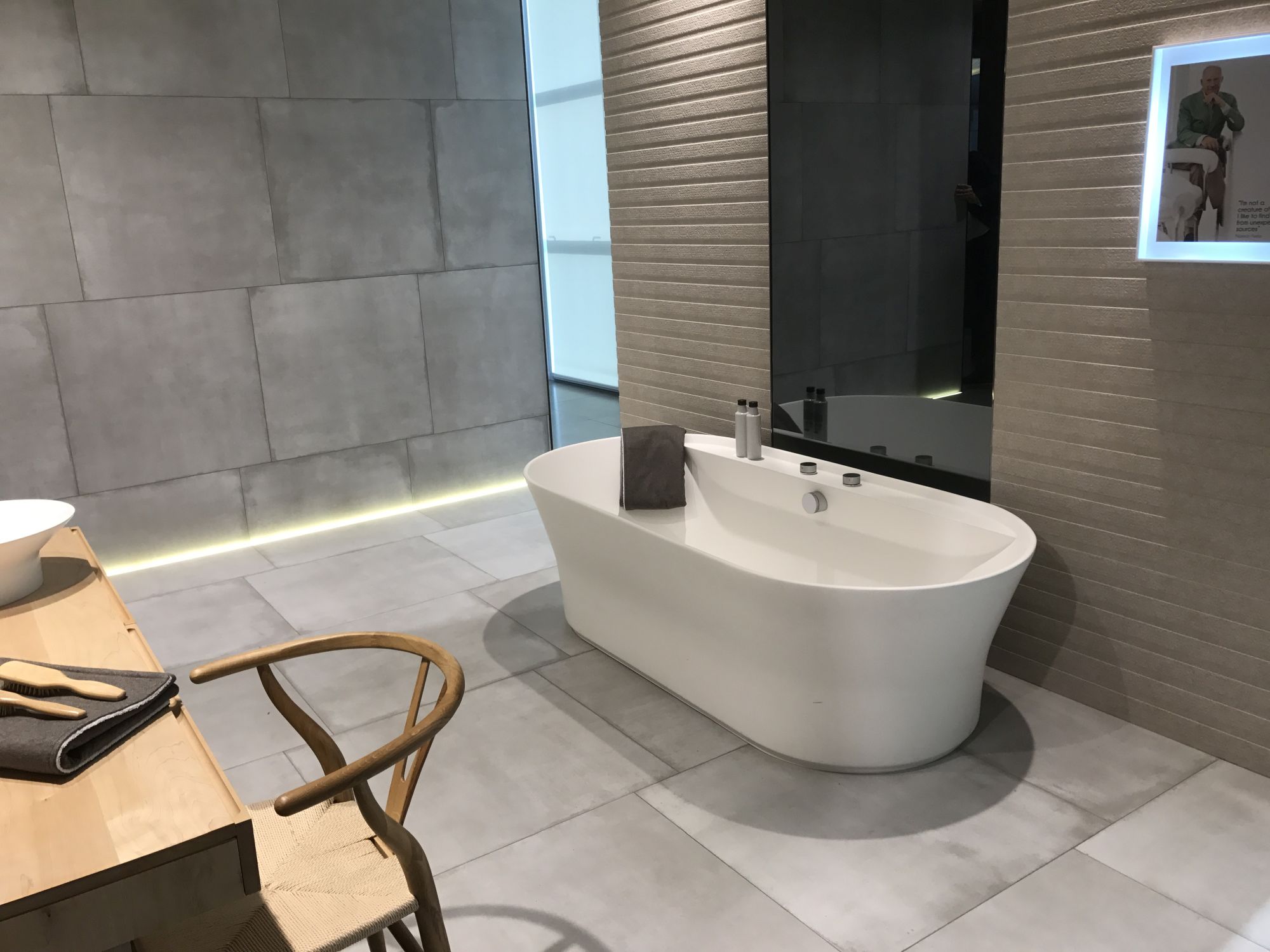 Cement like wall and floor tiles in modern bathroom design by Porcelanosa