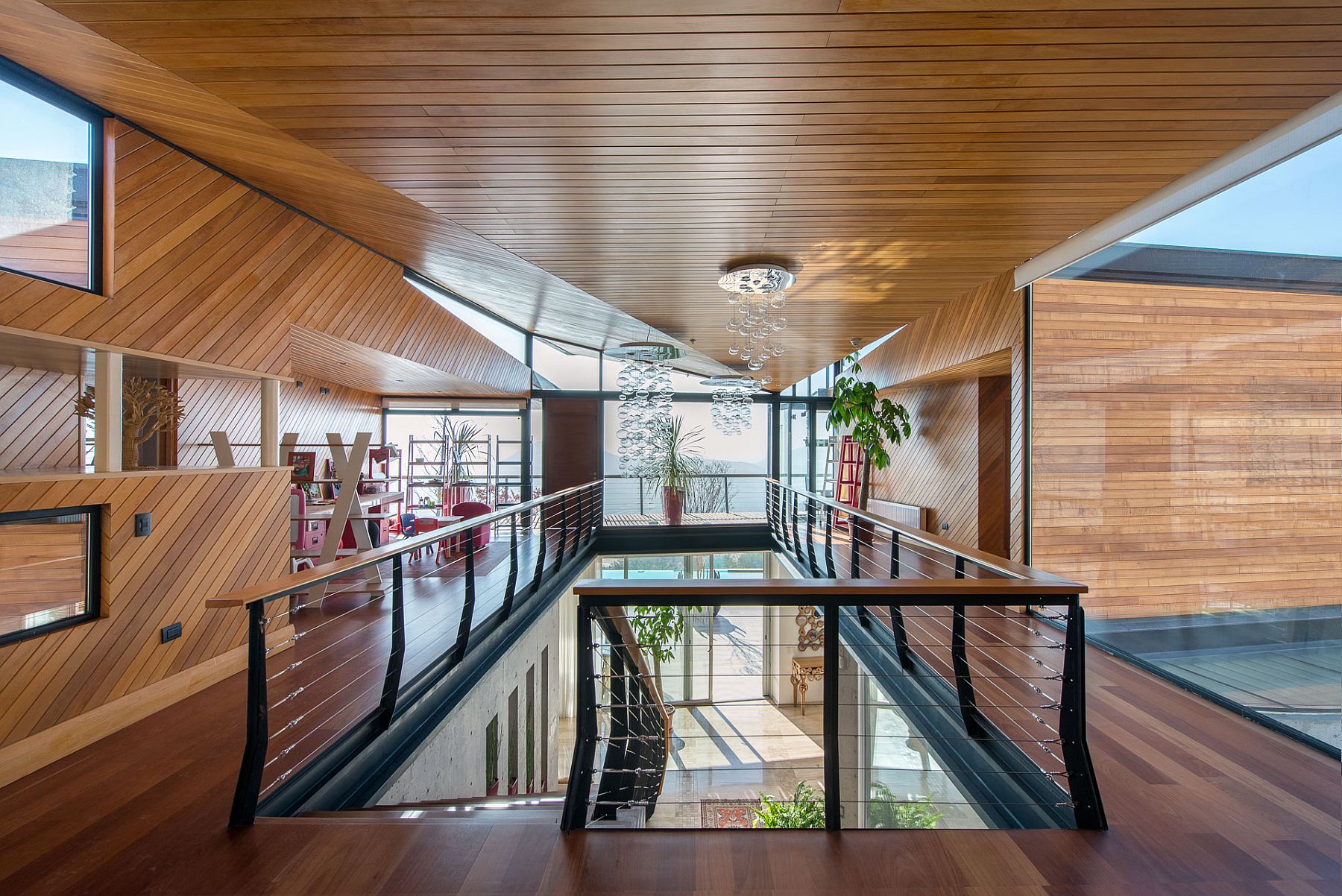 Chilean wood planks give the interior a stylish and inviting look 217x155 Sculptural Design at Its Spectacular Best: Luxurious Mountain Home in Chile