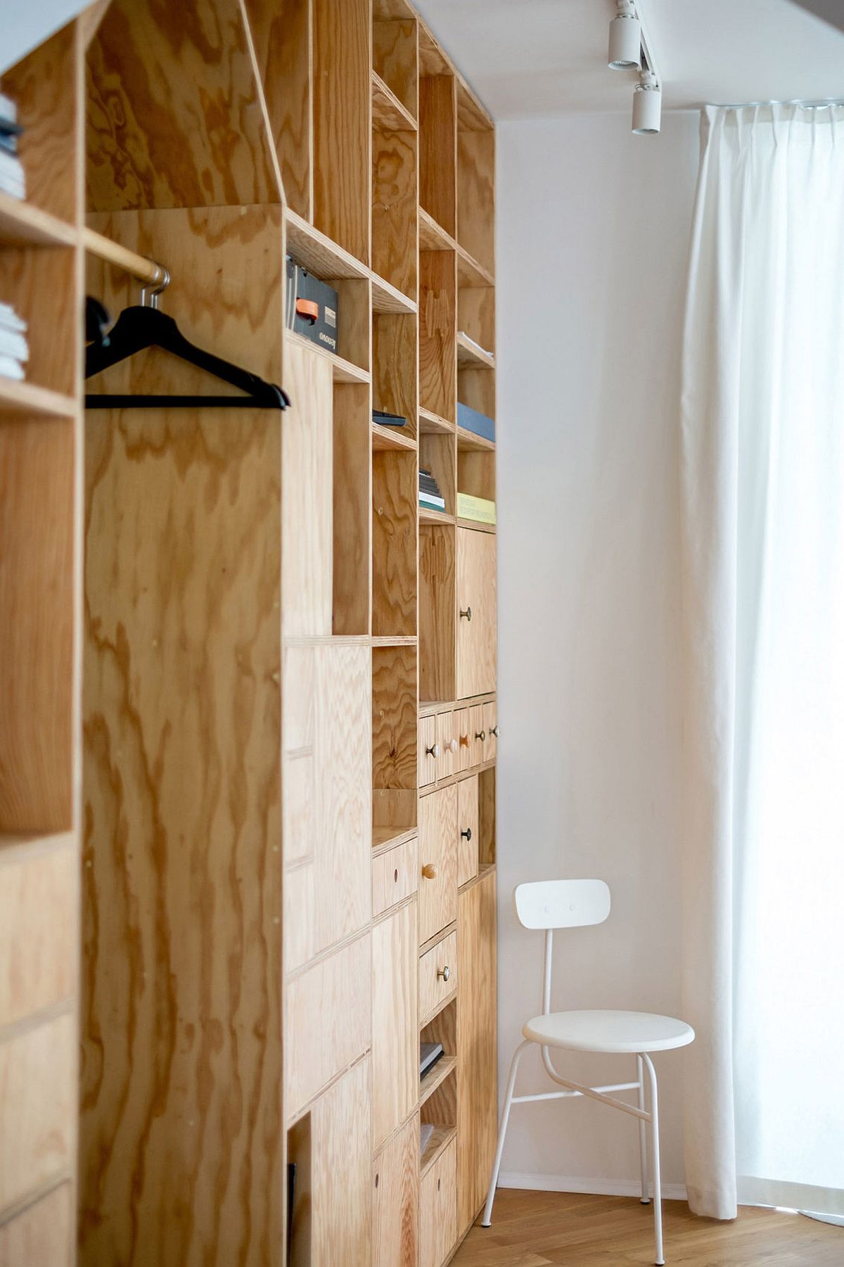 Closer look at the series of cupboards and shelves that make up the wooden partitions