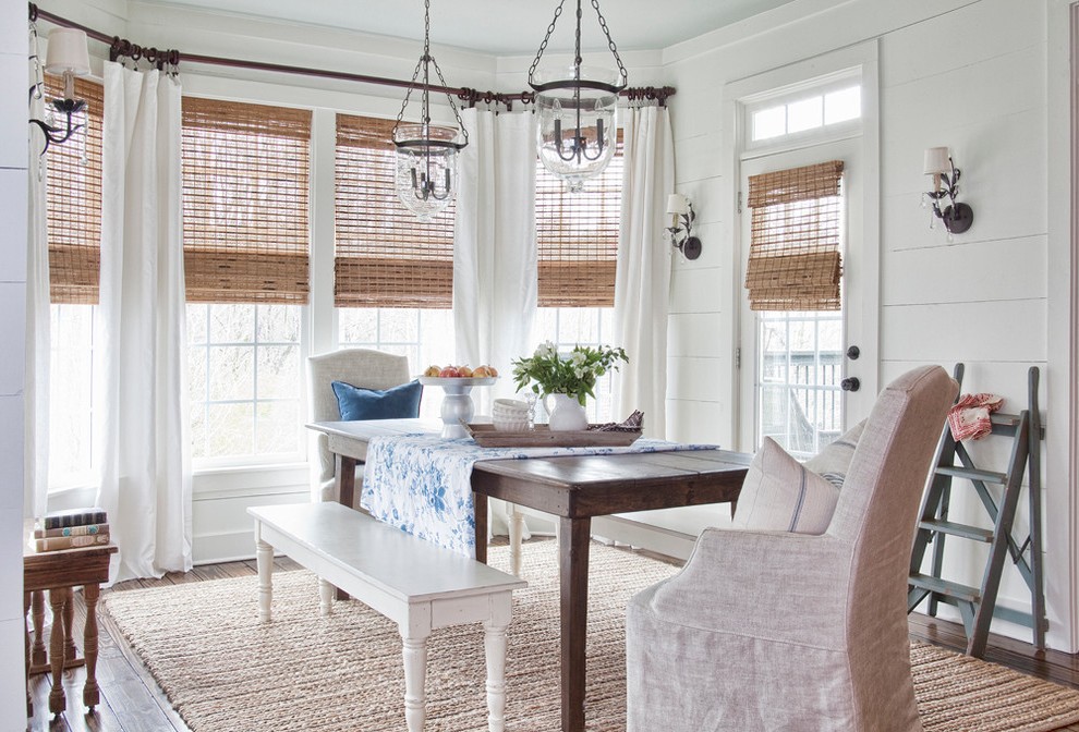 Coastal dining room with a rug that resembles the color of the sand