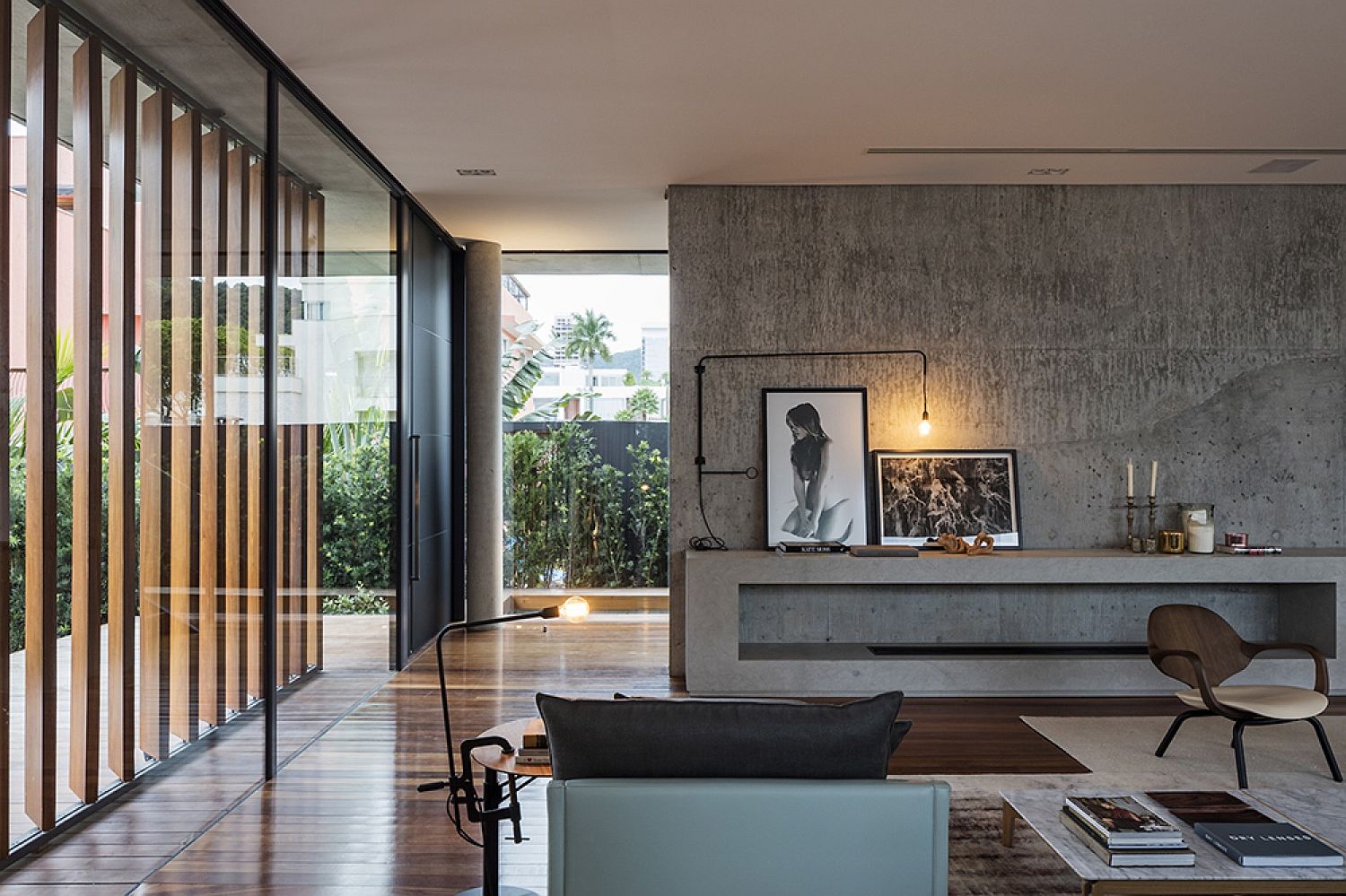 Concrete and wood shape the living room of Bravos House