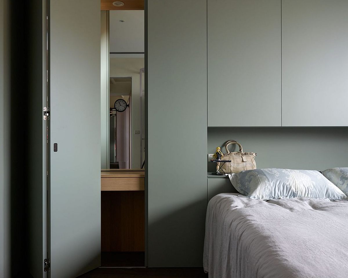 Contemporary bedroom in white with gray shelving