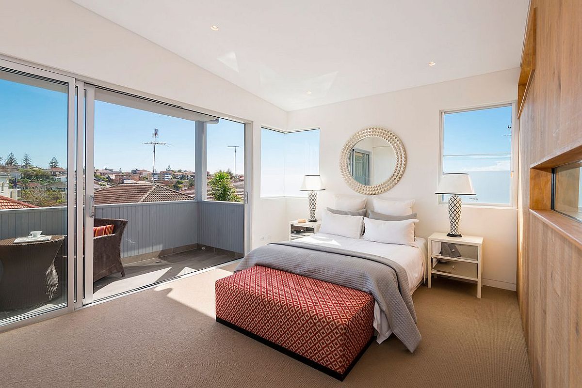 Contemporary-coastal-style-bedroom-with-a-small-balcony