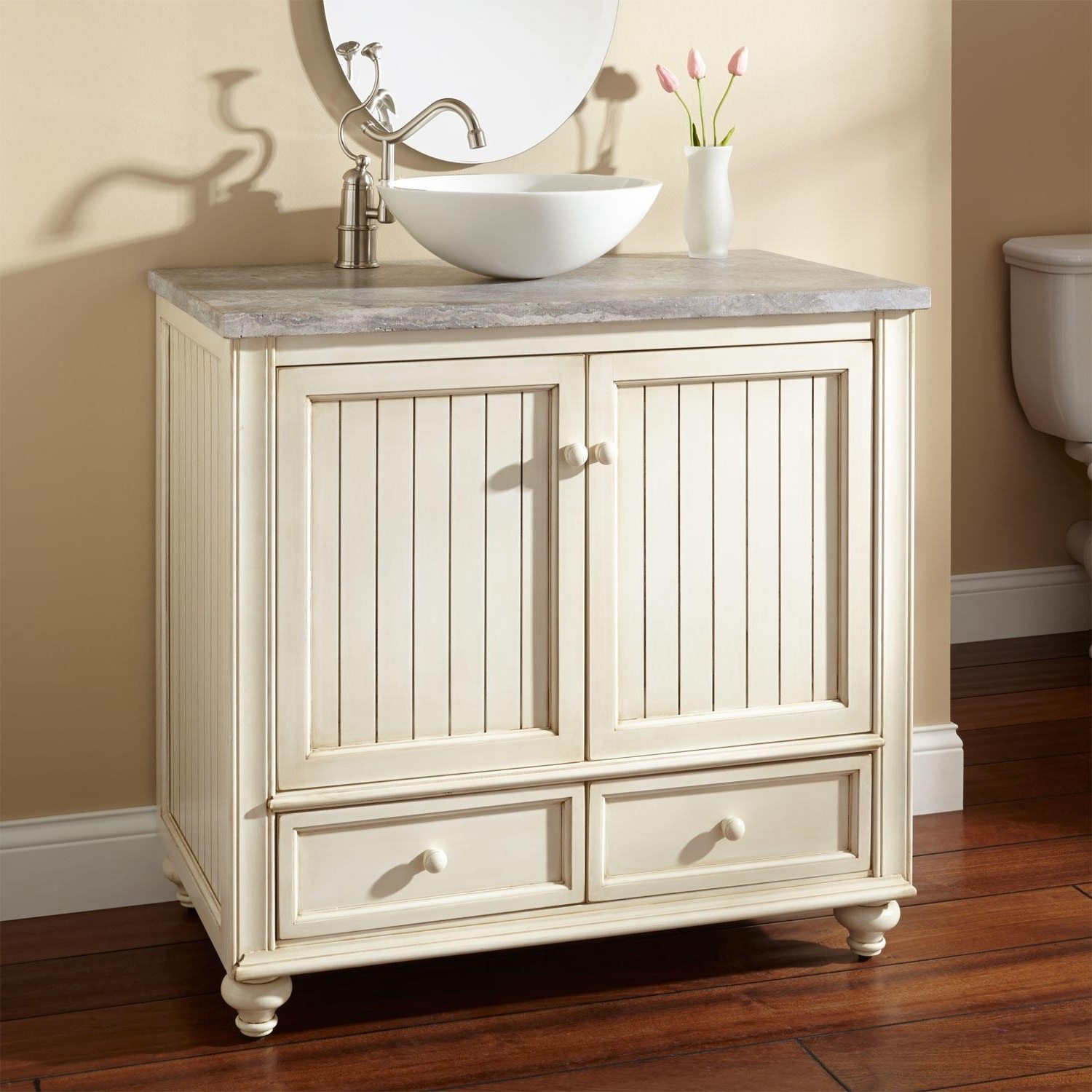 Cream colored interior paired with a bright white vessel sink