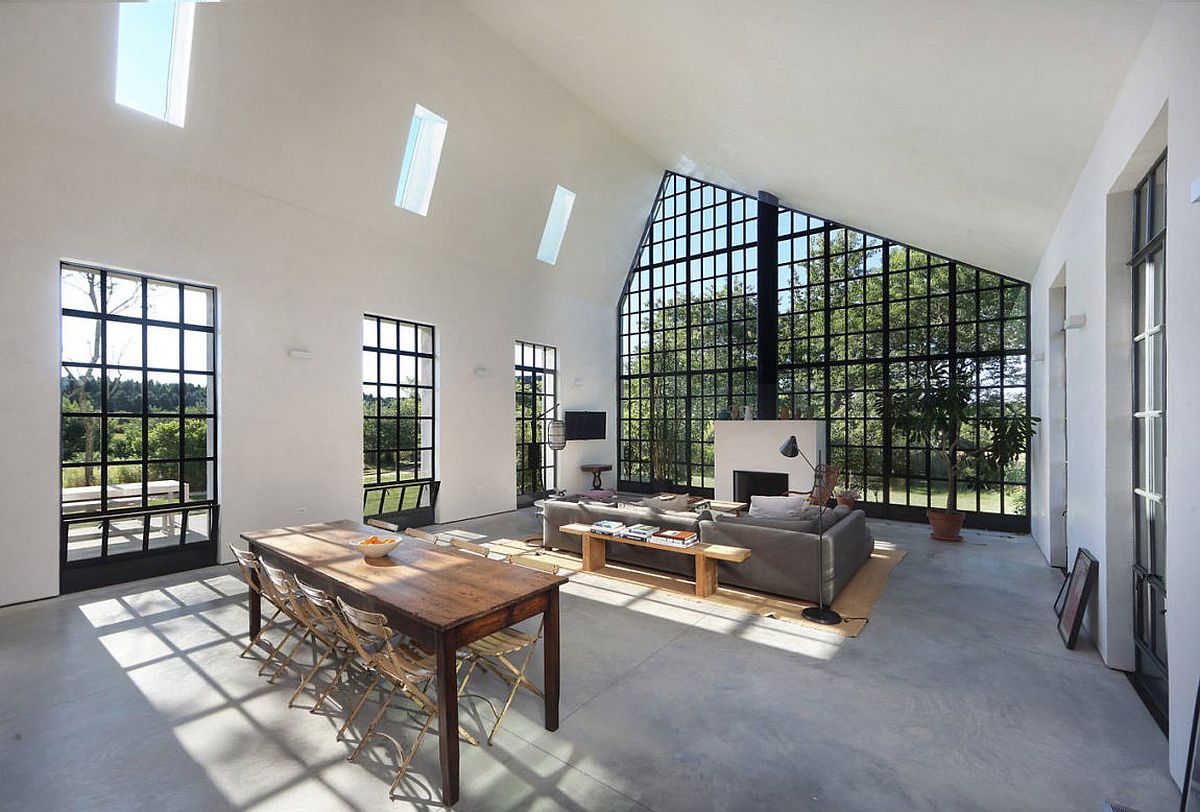 Dark framed windows bring the canopy indoors