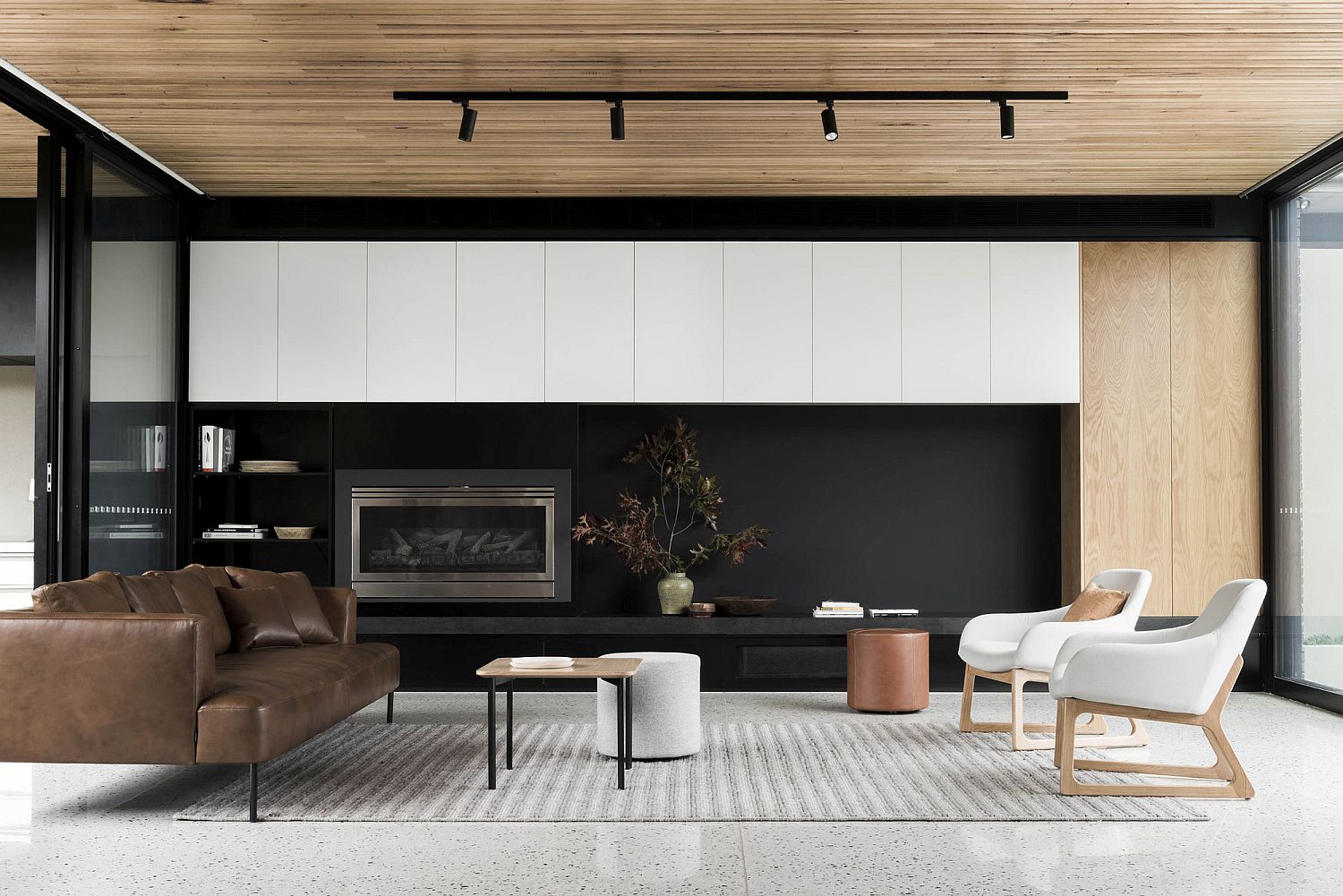 Dark wall in the backdrop adds to the sophisticated appeal of the interior