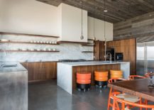 Dashing-contemporary-kitchen-in-marble-and-wood-with-colorful-bar-stools-on-wheels-217x155