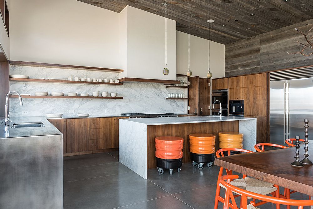 Dashing contemporary kitchen in marble and wood with colorful bar stools on wheels