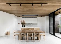 Dining-room-and-kitchen-in-white-with-wooden-ceiling-217x155