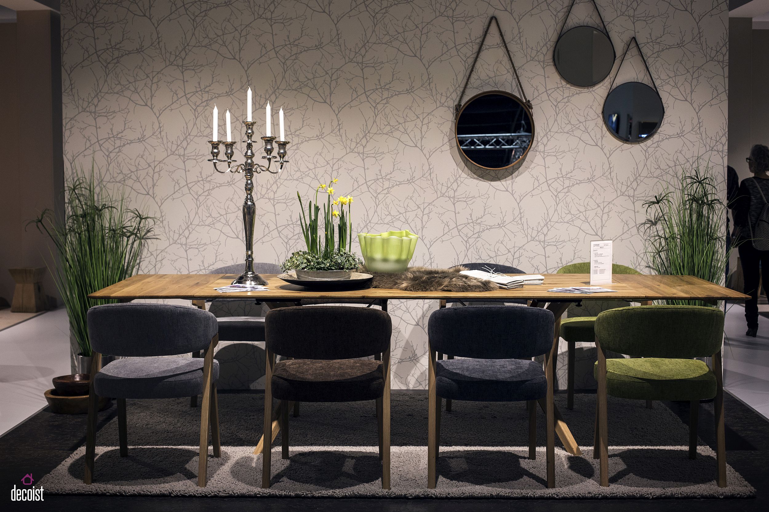 Dining room with wooden dining table, fabulous mirrors and a dashing backdrop