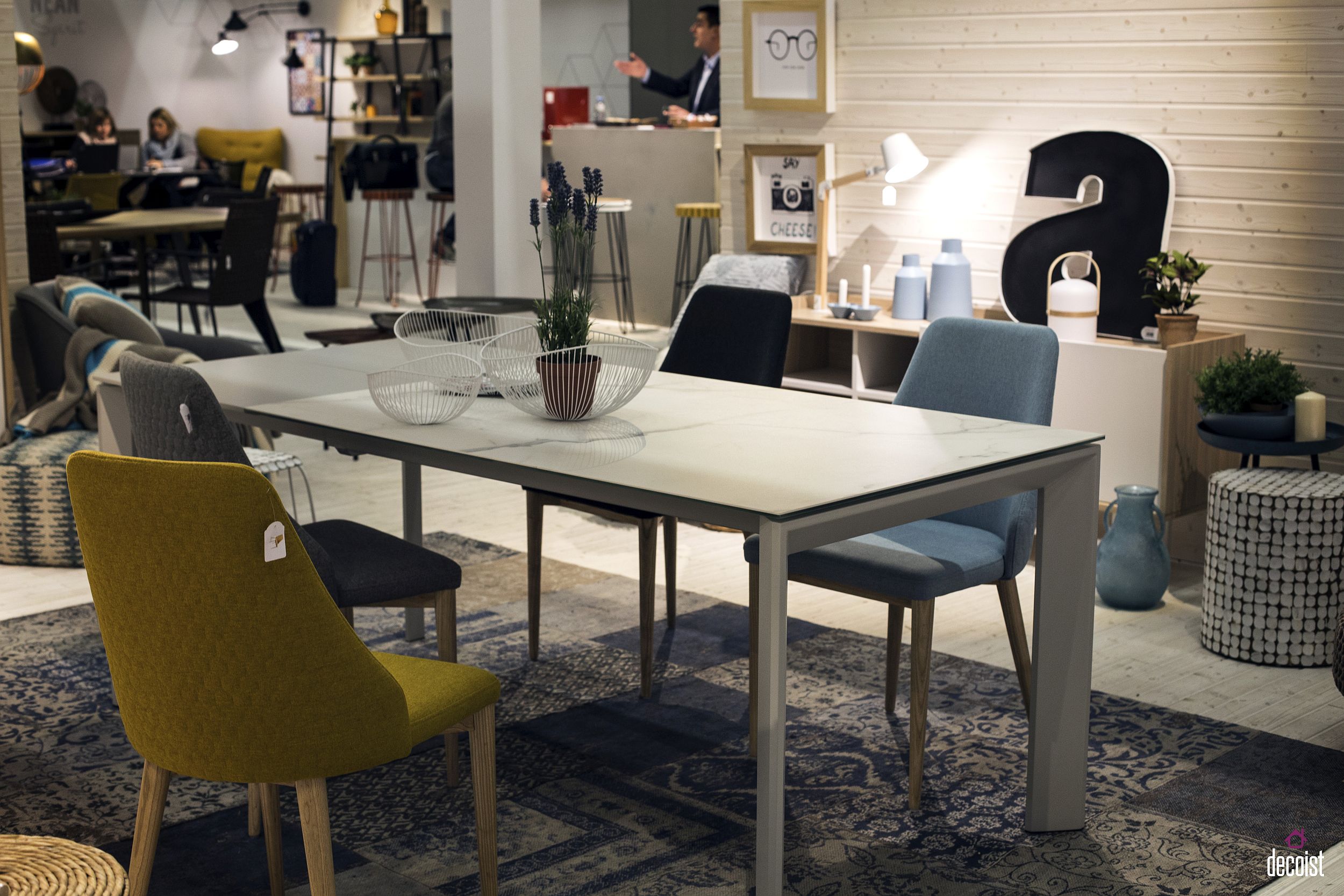 Eclectic collection of colorful chairs is a great way to energize the dining room