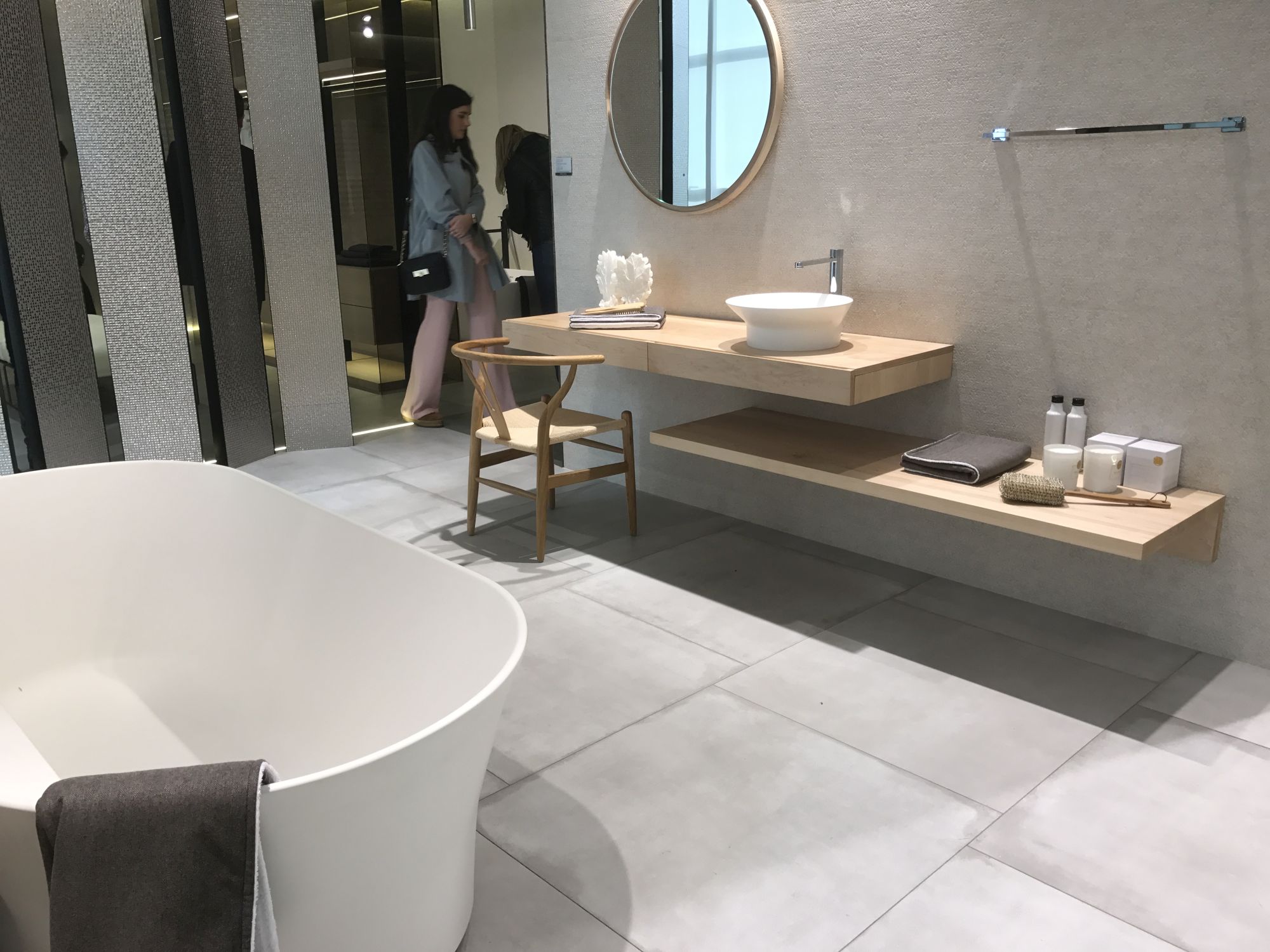 Elegant bathroom decor with large floor tiles by Porcelanosa