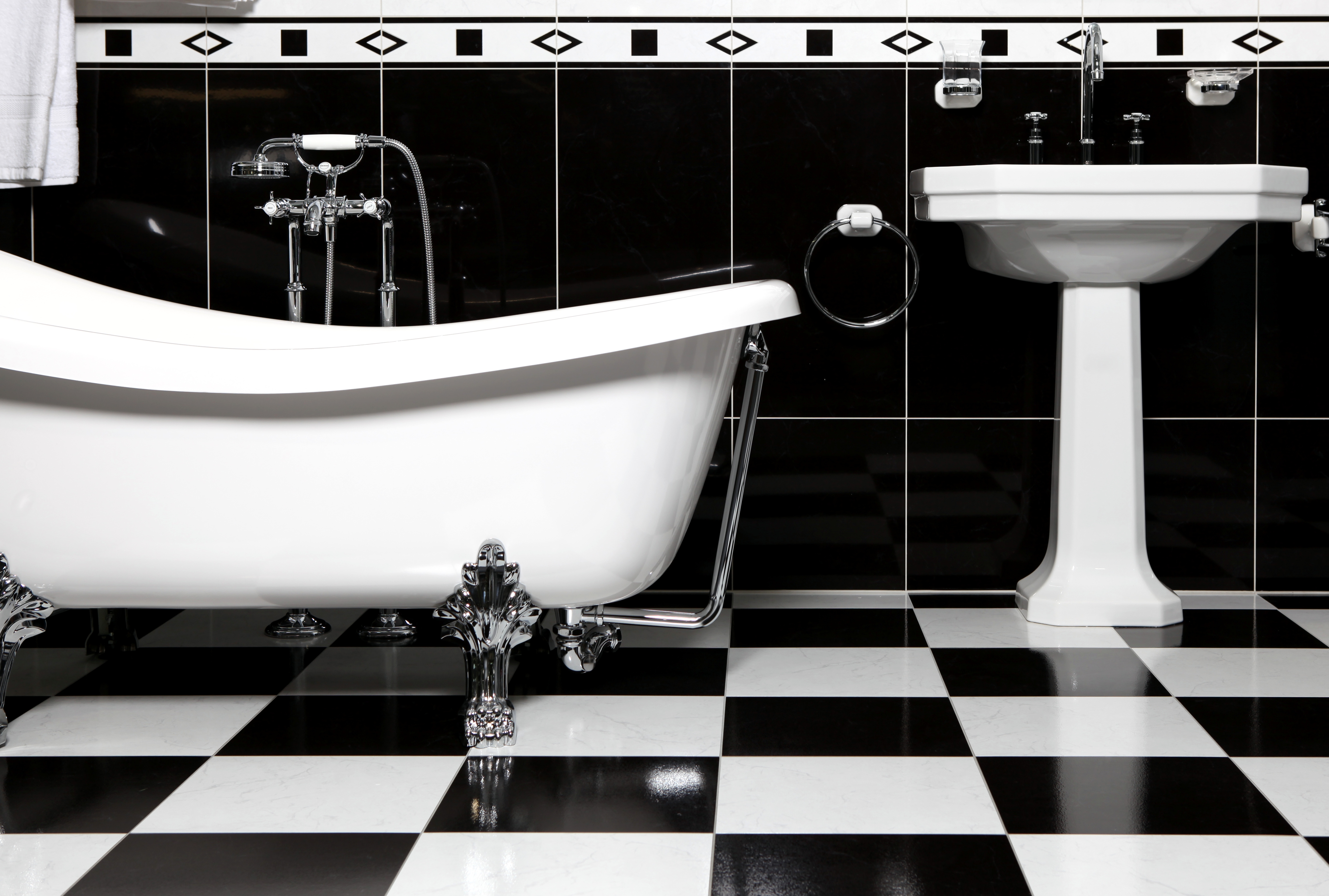 Emphasise the contrast between the black and the white in a checkered bathroom