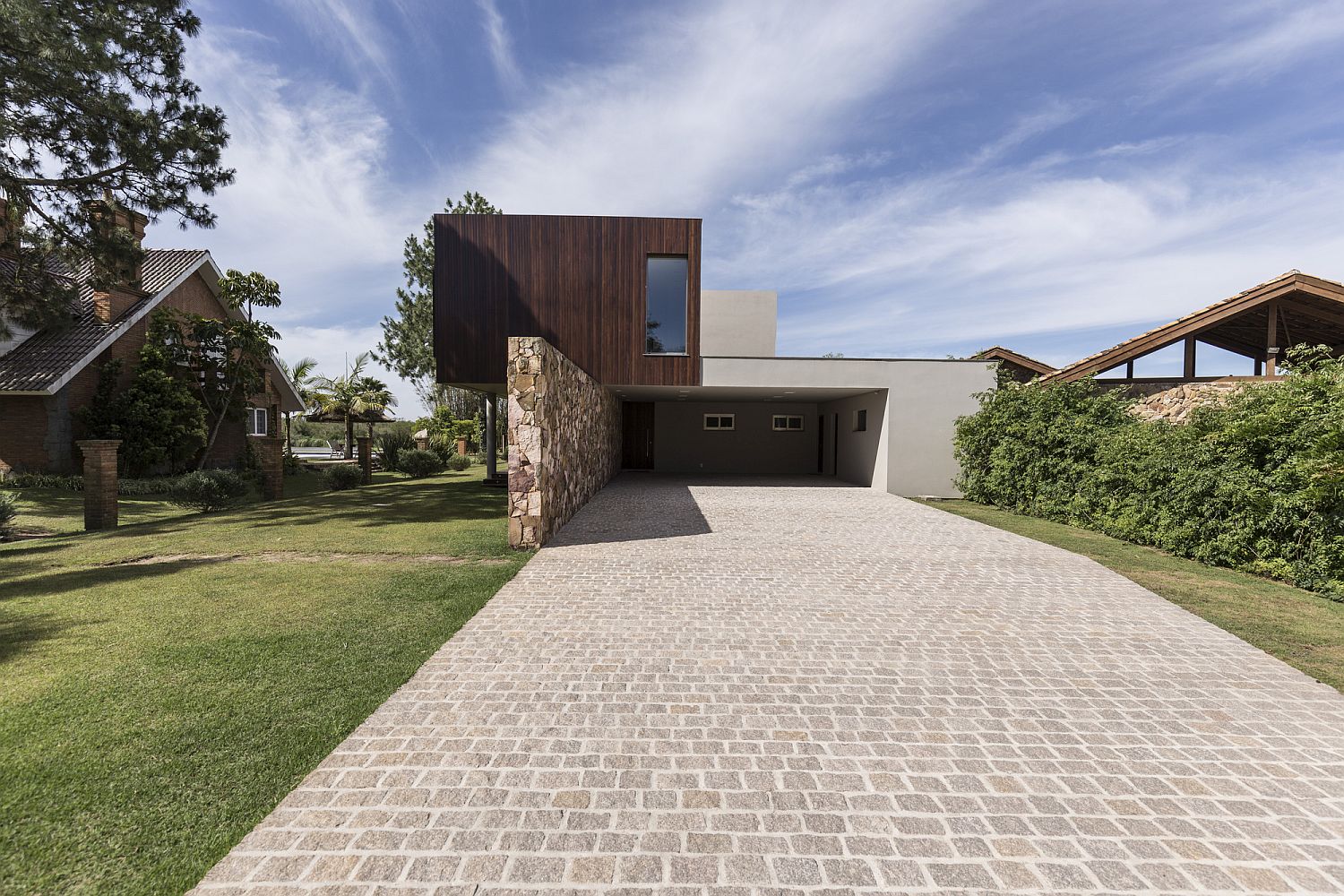 Entrance of stylish riverside home in Brazil with cantilevered design