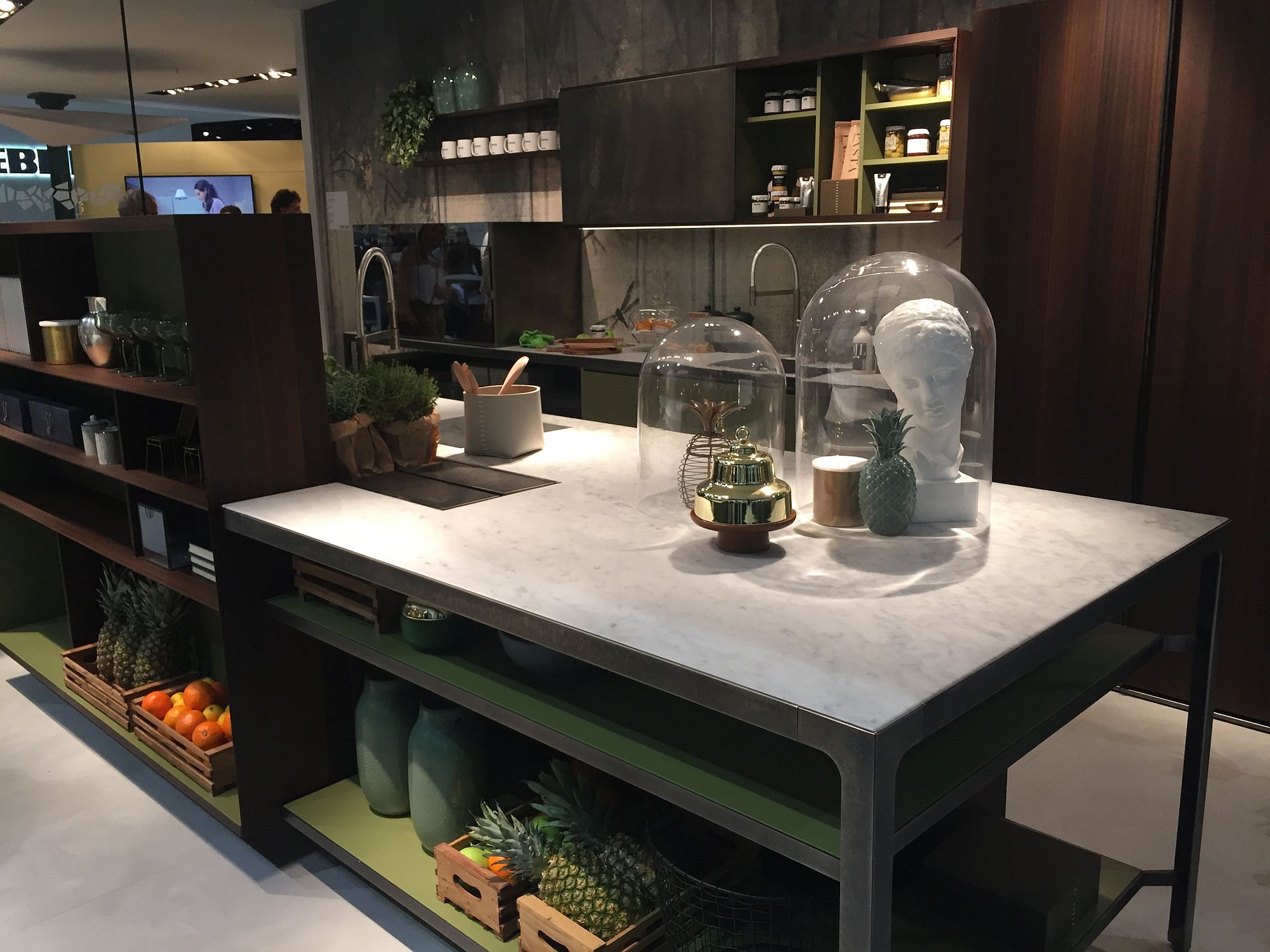 Expansive kitchen island in wood with marble coutertop