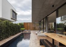 Expansive-wooden-deck-and-pool-connecetd-with-ground-level-living-area-217x155
