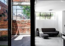 Exposed-brick-wall-sections-and-windows-preserve-the-classic-appeal-of-the-building-217x155