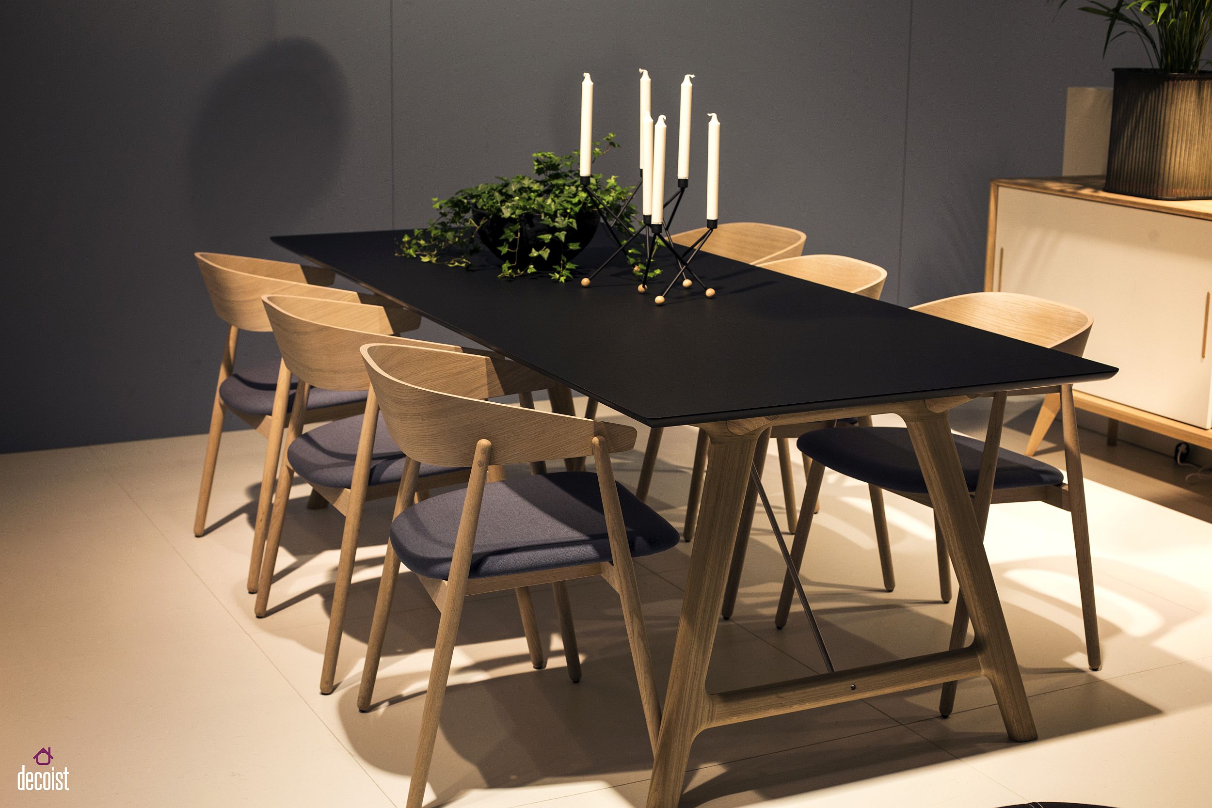 Fabulous wooden dining table with matching chairs and a dashing black tabletop