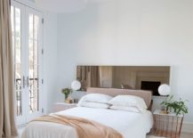 Feminine-bedroom-in-white-and-light-brown-with-matching-bedside-tables-217x155