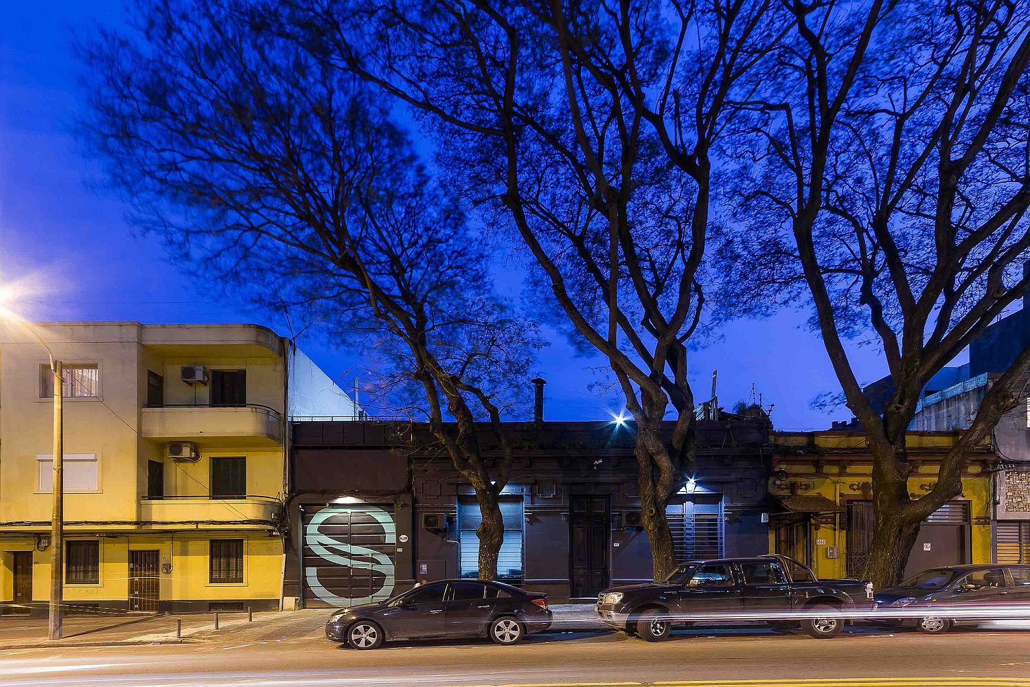 Garage door with company logo welcomes you at this remodeled industrial office building