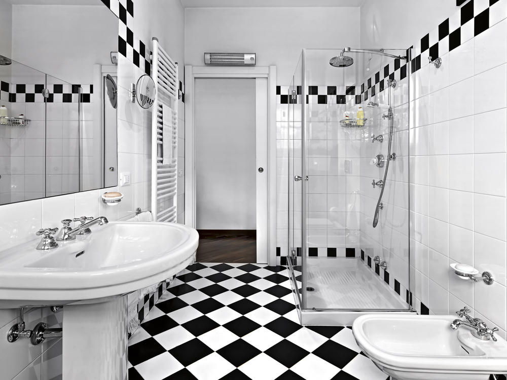 Glass shower in a monochrome checkered bathroom