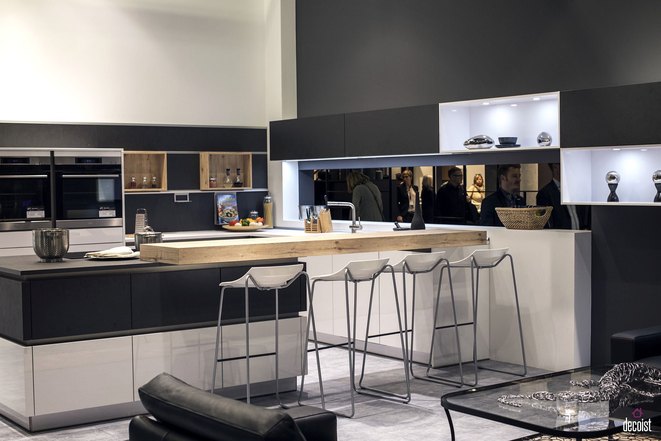 Gray and white kitchen island with a wooden breakfast bar