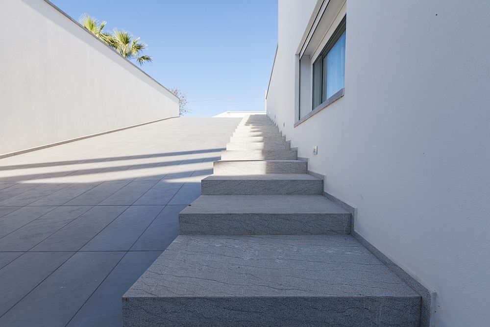 Grigio Ducale marble paving leads to the interior