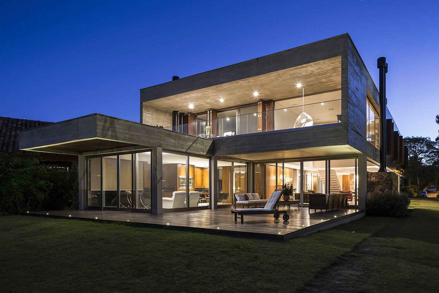 In-ground lighting around the wooden deck defines it stylishly