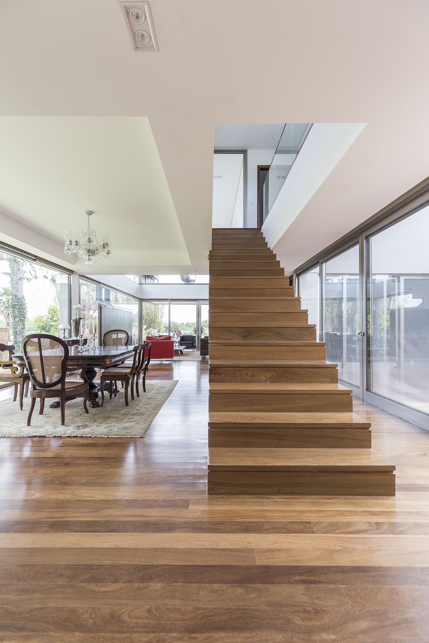 Ingenious staircase design also brings natural light into the lower level of the home