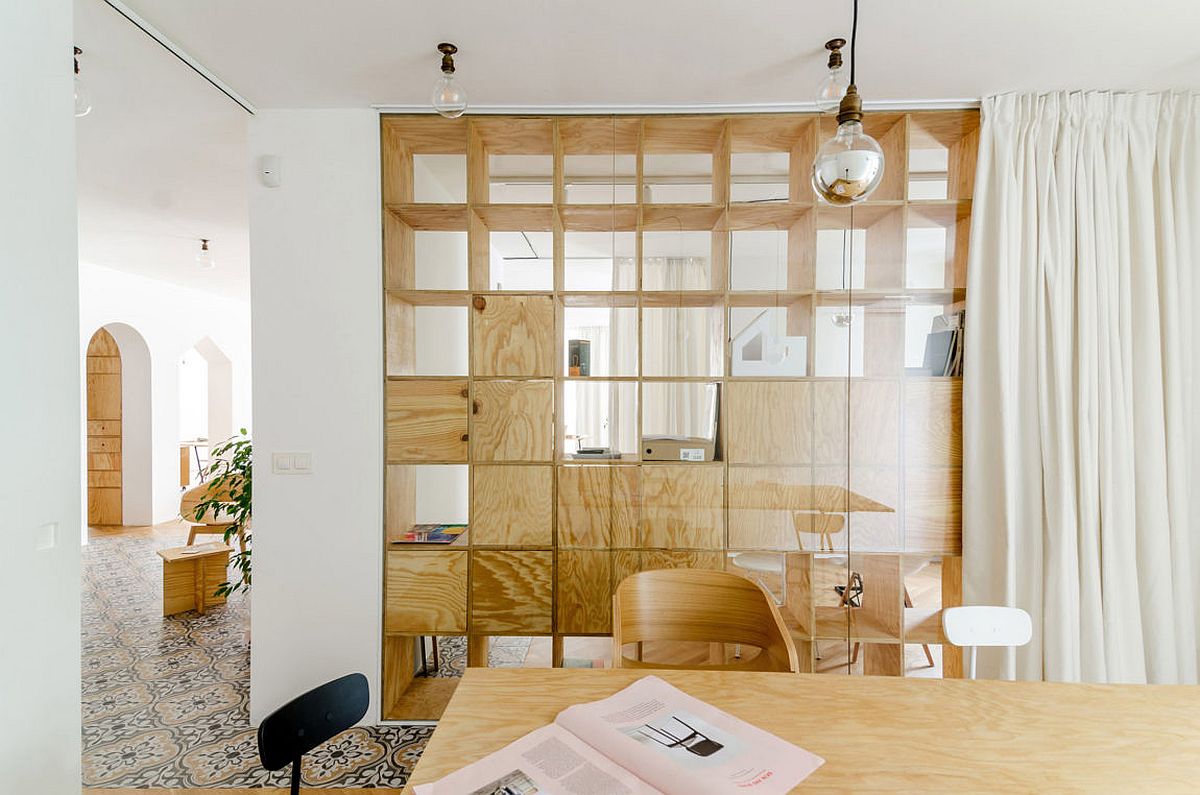 Ingenious wooden partitions create visual connectivity between various workzones