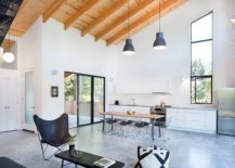 Interior-in-neutral-hues-with-a-tilted-wooden-ceiling-and-stylish-windows-217x155