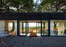 Large-glass-walls-and-sliding-glass-doors-transform-the-shipping-container-217x155
