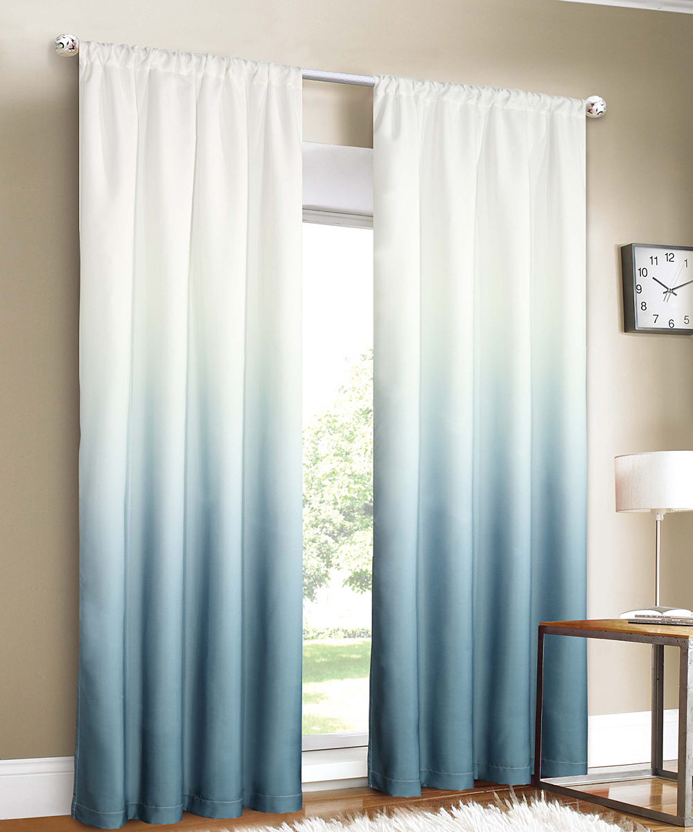 Light-blue-ombre-curtains-that-stand-out-in-a-brightly-lit-room