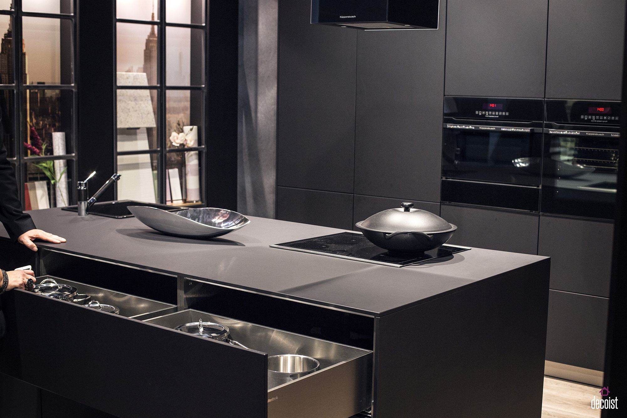 Lighting alters dramatically the appeal of contemporary kitchen in darkers shades of gray and black