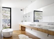 Long-wooden-vanity-in-the-bathroom-with-marble-top-217x155