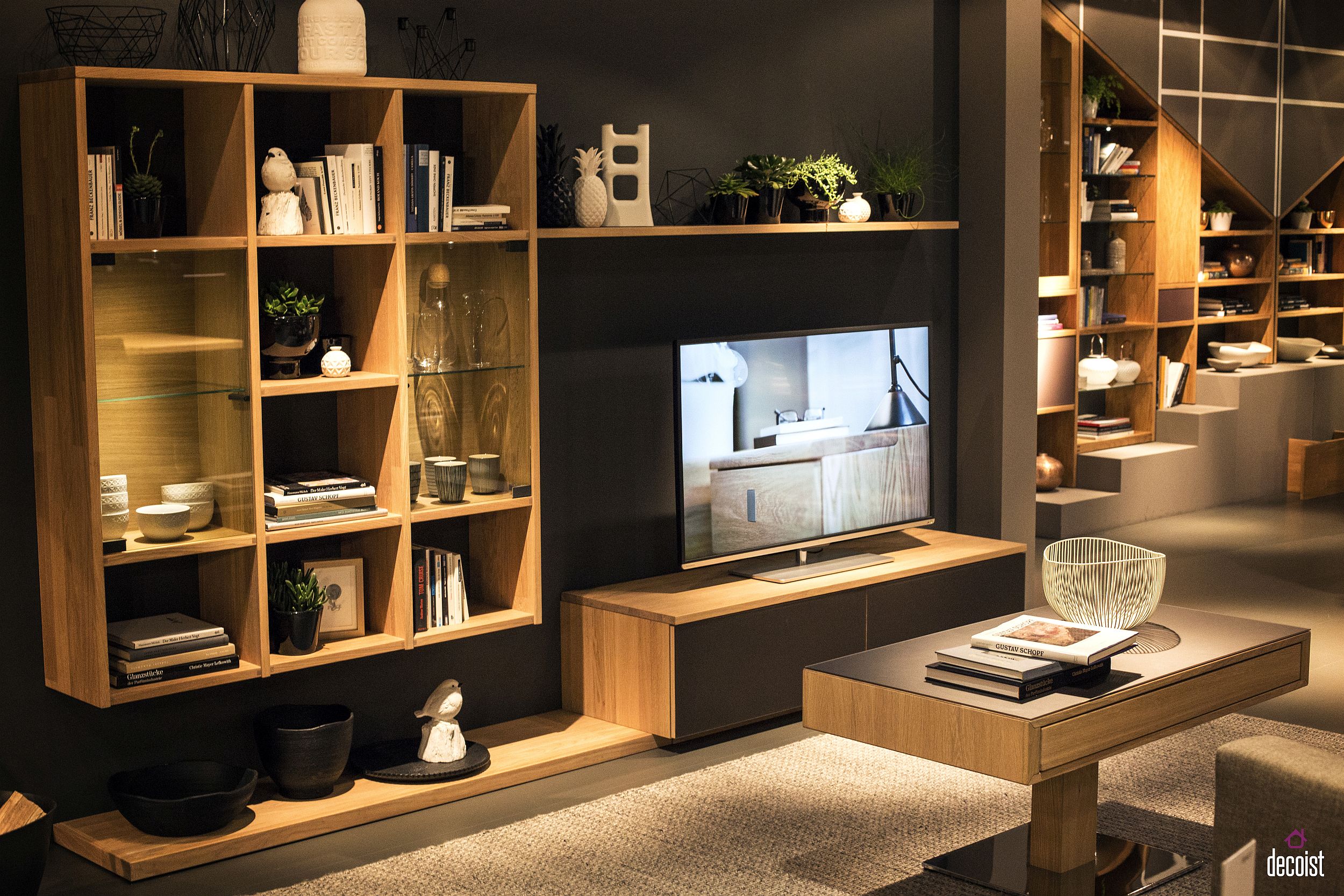 Matching shelves, cabinets and coffee table add to the charm of the living room TV unit