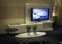 Minimal TV stand hides away connecting wires and outlets with ease 217x155 Tastefully Space Savvy: 25 Living Room TV Units That Wow!
