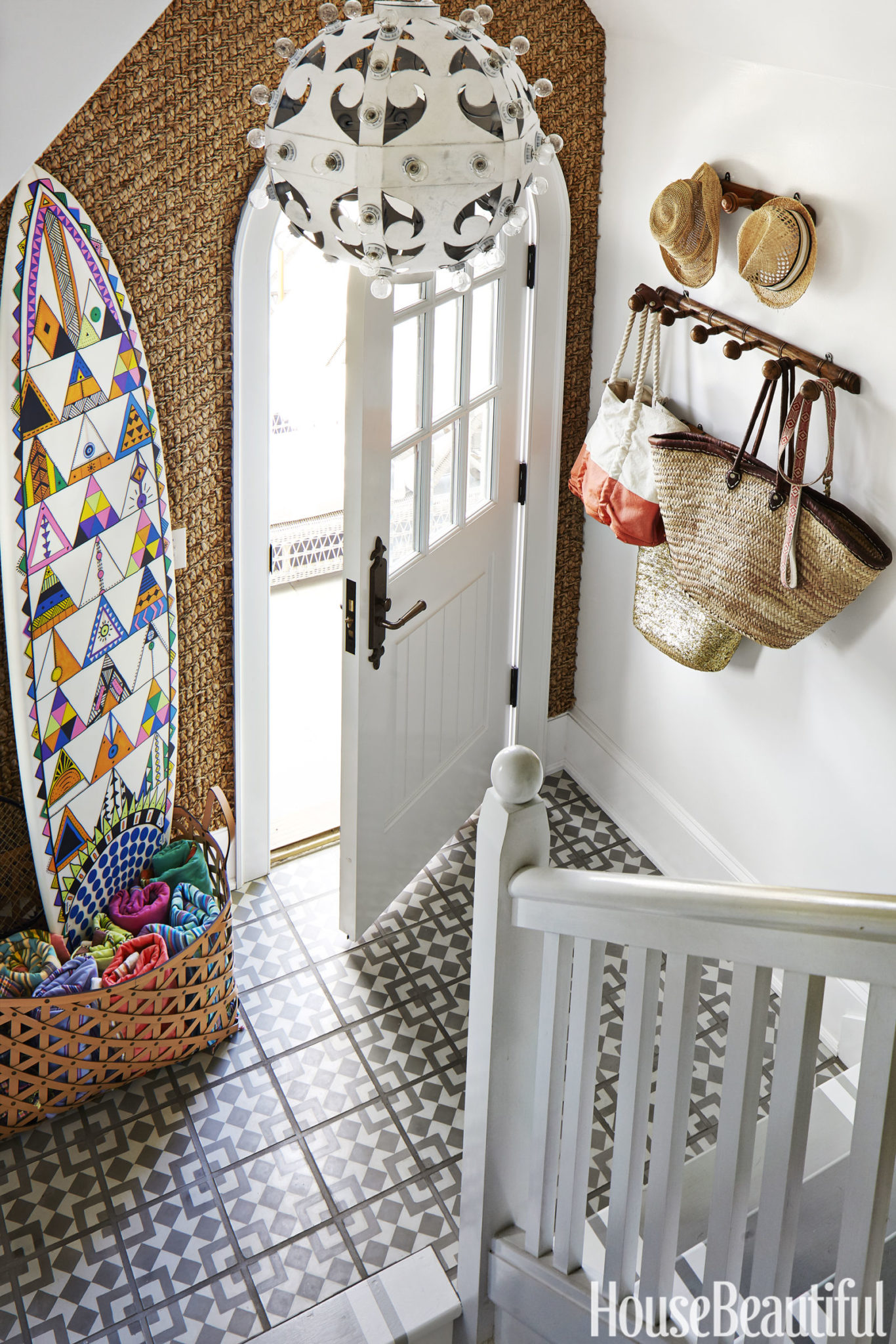 Minimalist coastal entryway with a simple coat rack