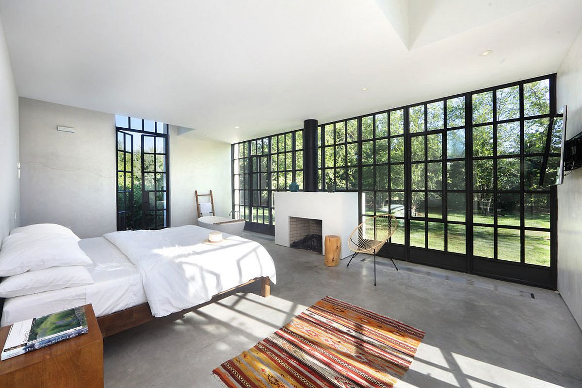 Modern and minimal bedroom with a view of the outdoors