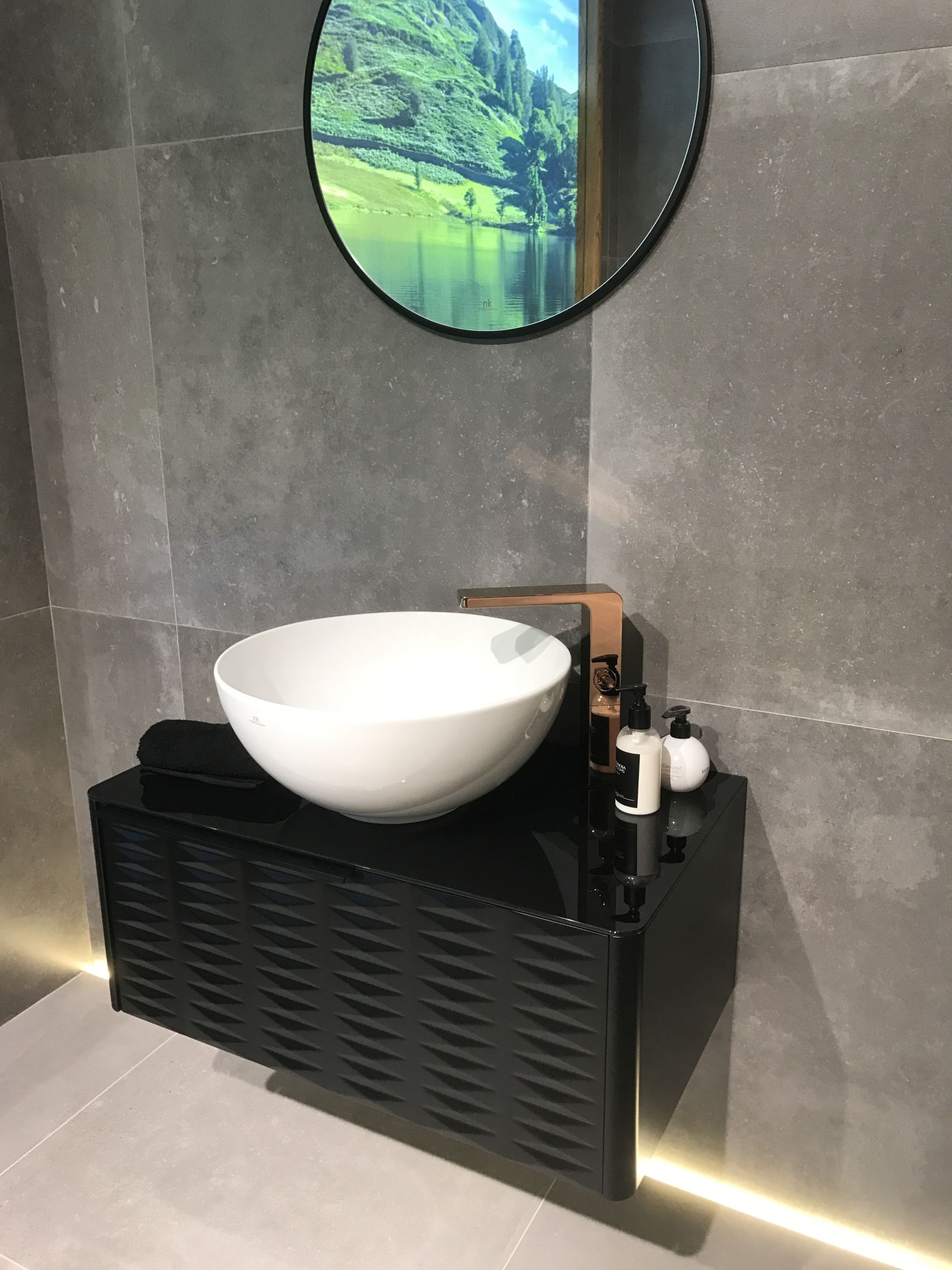 Modern bathroom furniture with copper finished taps