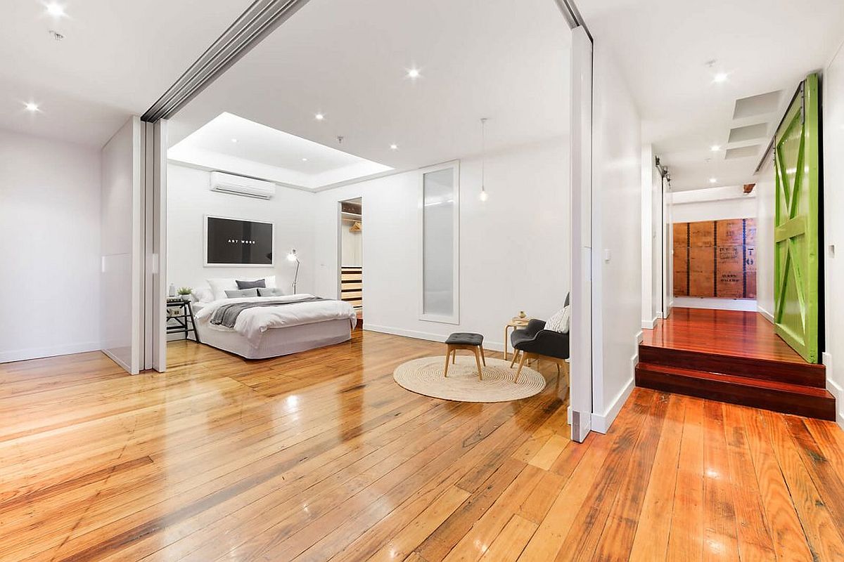 Modern-bedroom-in-white-connected-with-the-open-plan-living