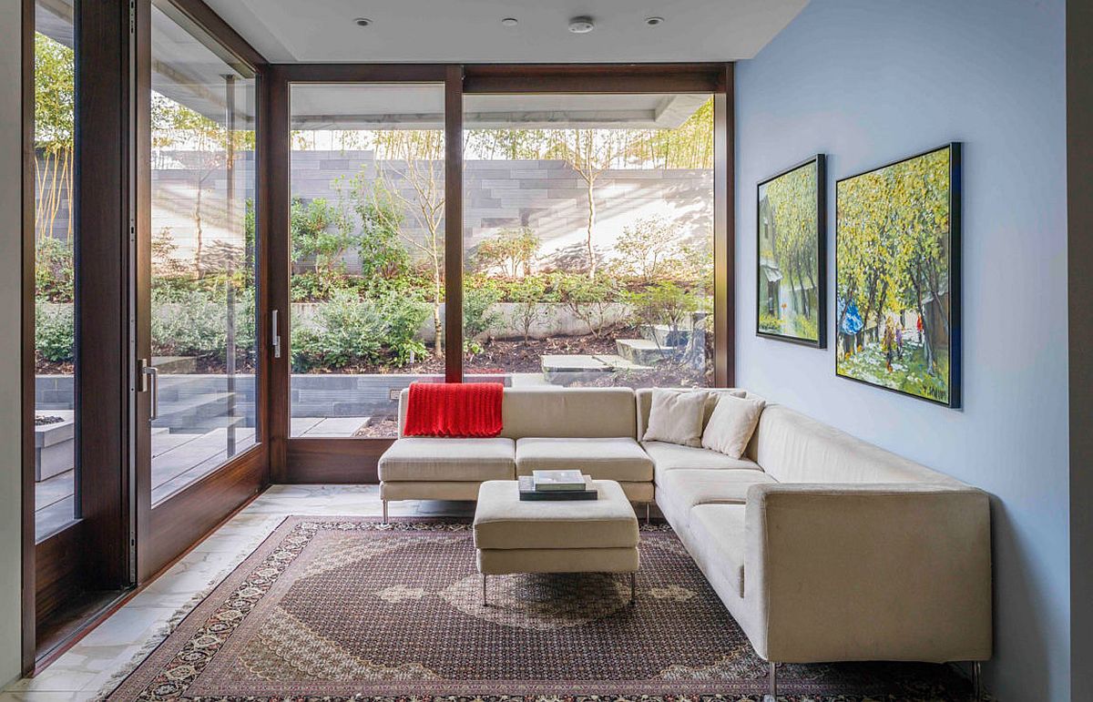 Modern sunroom and lounge with a comfy sectional