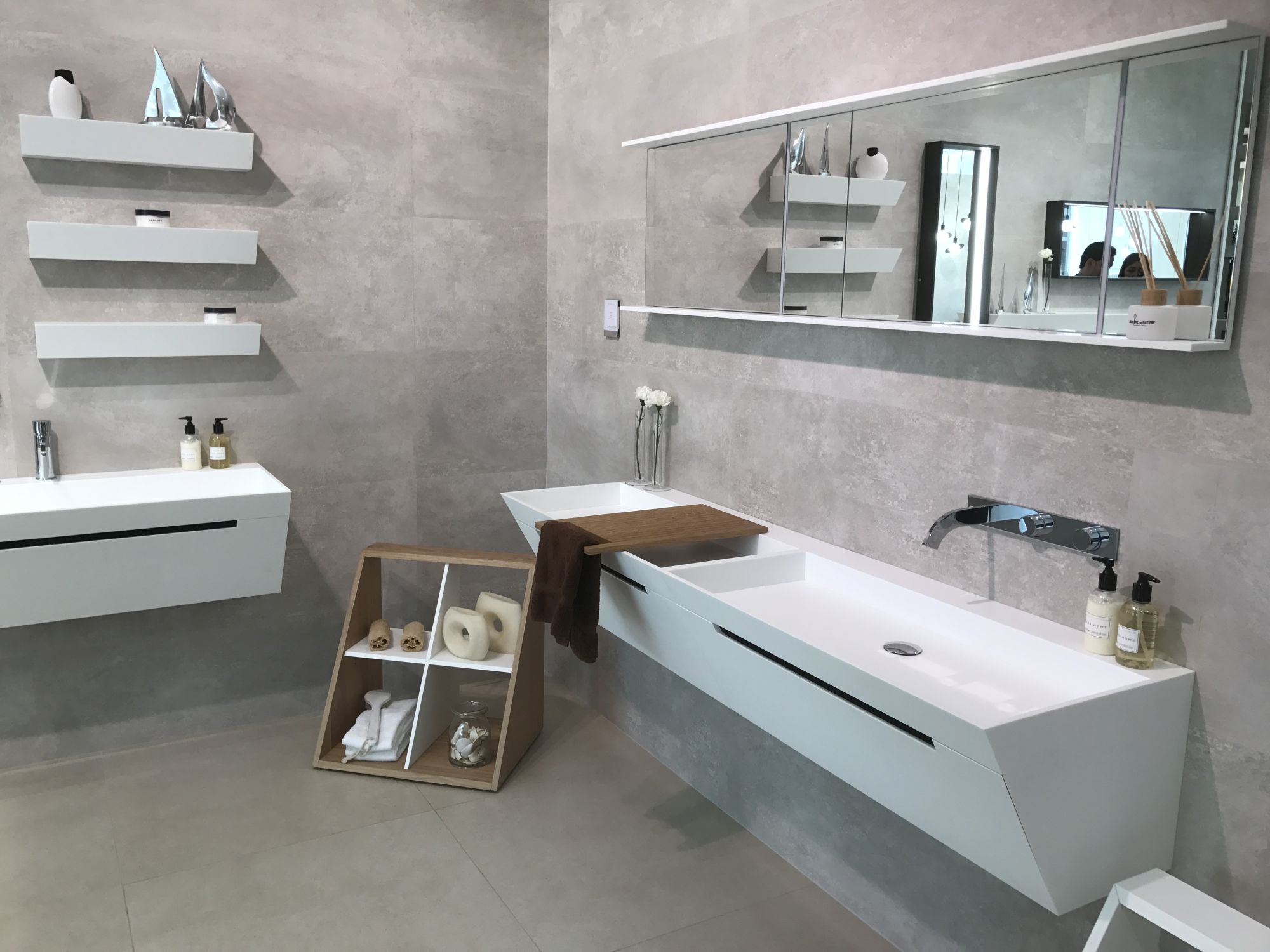 Modern white bathroom furniture with concrete looking tiles on the walls - GamaDecor