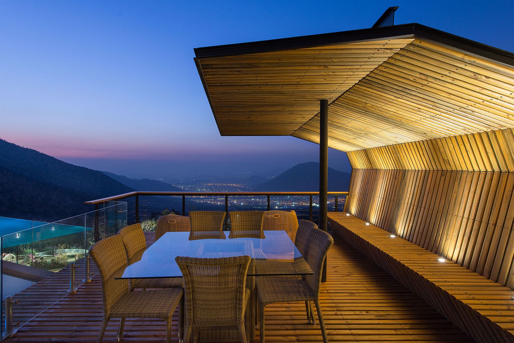 Open wooden deck along with a shaded sitting area with stunninv views of the valley