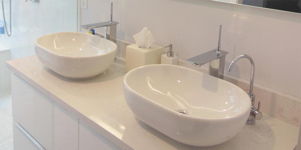 Oval vessel sink in a minimalist bathroom