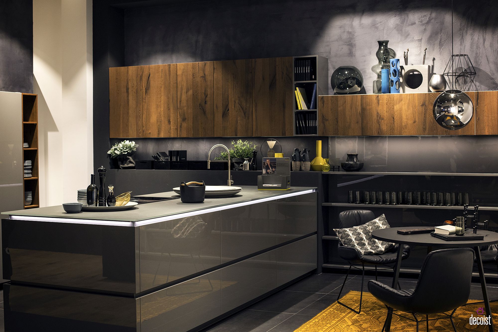 Polished kitchen counter space and backdrop in gray along with wooden cabinets