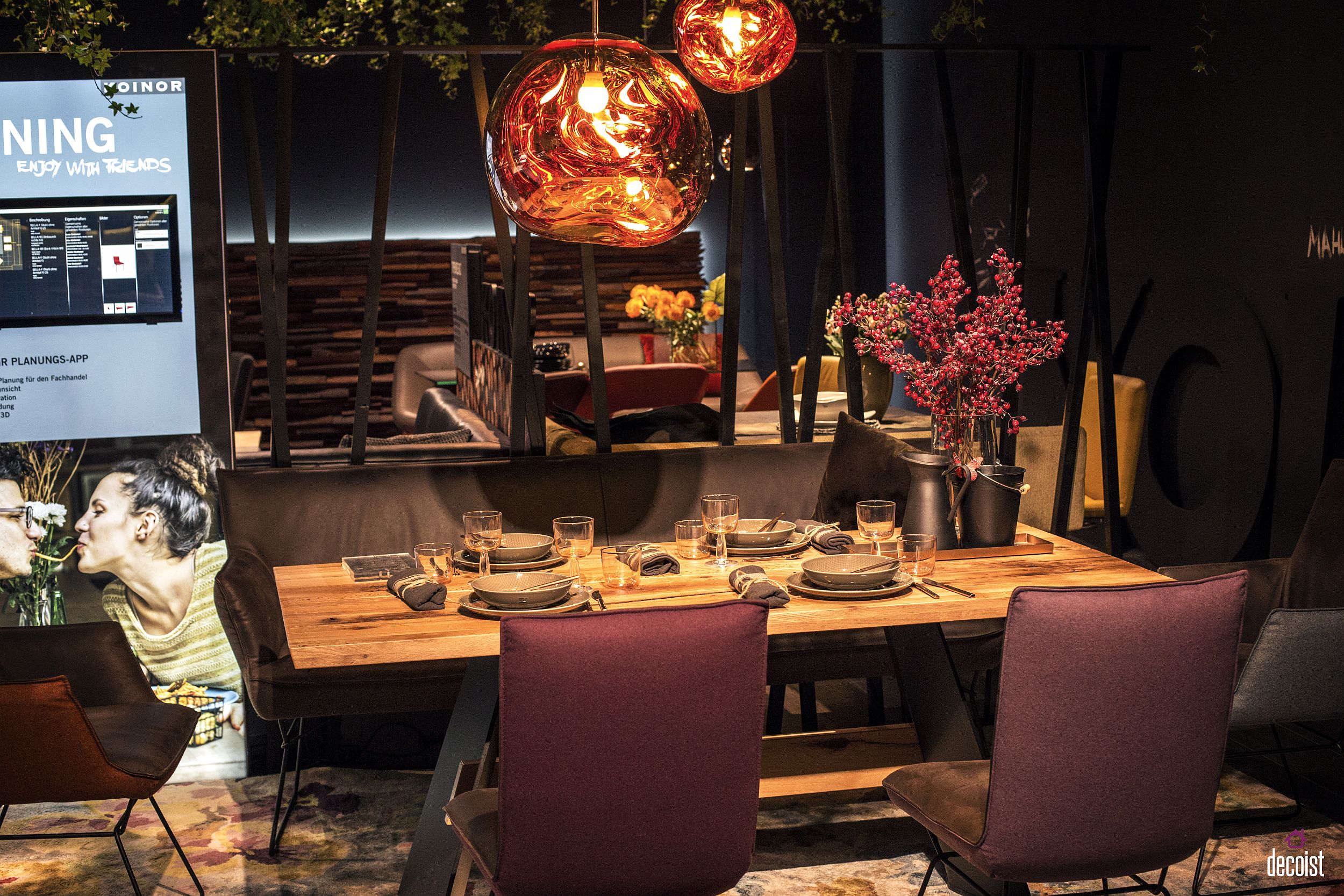 Pops of color, comfy bench and brilliant lighting shape a stylish and cozy dining area