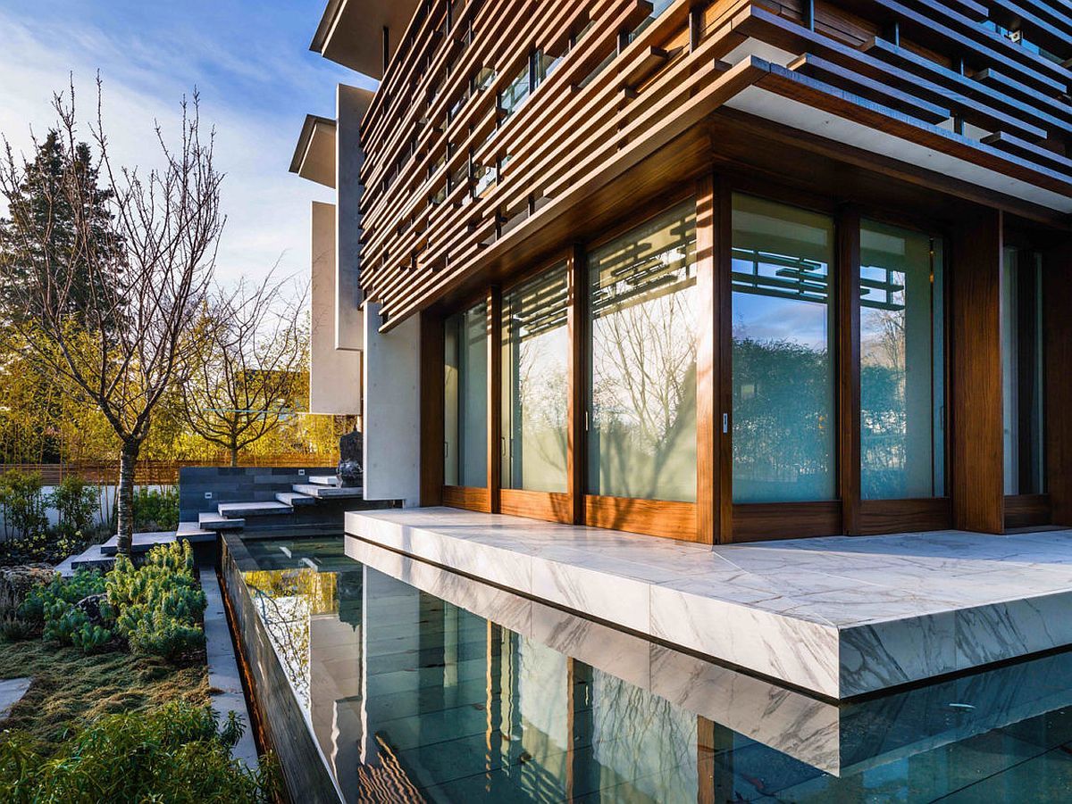 Reflecting pool and wooden slats give the Vancouver home an Oriental vibe