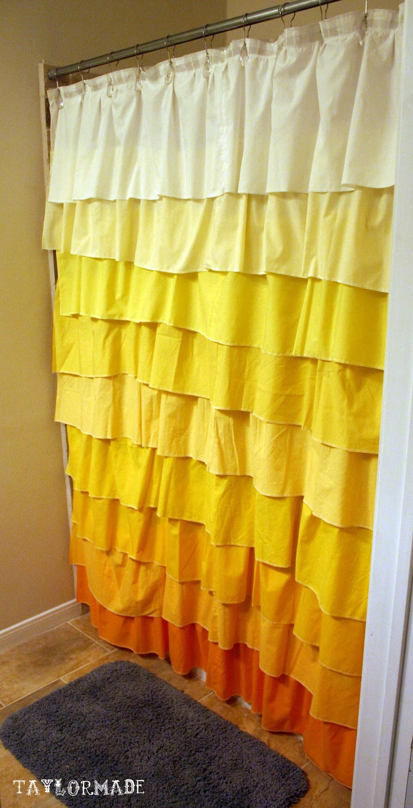 Ruffled shower curtain with a bold warm ombre