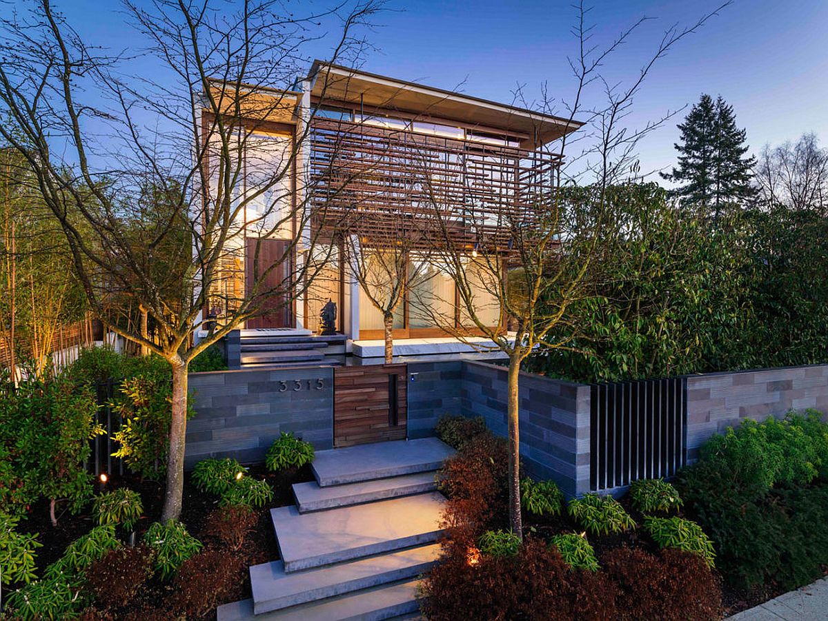 Sapele wood slats and a wall of greenery create a beautiful street facade at the Vancouver Residence